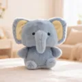 Close-up detail shot of a cute blue plush elephant toy featuring soft fur and yellow inner ears. - Elephant (20cm)