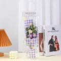 Handmade crochet flower bouquet in clear gift bag with purple checkered wrapping paper. - With LED Light / Purple