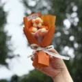 Mini knitted crochet flower bouquet handmade yarn gift for holiday party table decor. - Orange