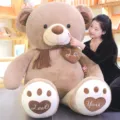 Giant teddy bear plush toy with scarf and heart details soft stuffed animal gift for girlfriend - Almond Milk Coffee / Total Length 1m (Right Angle 1.4m)