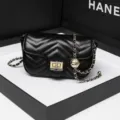 Black quilted chain crossbody bag for women, stylish minimalist shoulder bag with lock. - Black