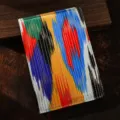 Taccuino in tessuto in stile etnico con strisce colorate vivaci, ideale per diario e note. - Filo Oro Colorato