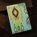 Primo piano dettagliato della copertina per taccuino in tessuto etnico fantasia Ikat. - Verde