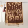 Detailed view of the elegant ethnic style knitted winter scarf featuring classic patterns and fringe design. - Xinjiang Shawl Style 5