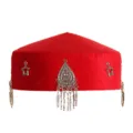 Kazakh ethnic red hat with silver pendant, star charms and tassels. Retro style detail shot. - Feather Style Red