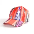 Close-up detail of ethnic style baseball cap featuring vibrant ikat pattern and curved brim. - Atlas Pattern 10