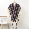 Ethnic style knitted long cape with geometric patterns, ruffled edges, and tassel details. - Ruffle Pendant Shawl F