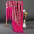 Detailed view of women pink winter warm cashmere imitation shawl with golden paisley embroidery. - Rose Red