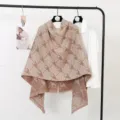 Detailed view of brown heart pattern cashmere feel scarf tassel hem soft texture fabric. - Large Houndstooth Beige Coffee
