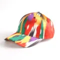 Close-up detail of a colorful ethnic style patterned baseball cap with vibrant abstract print. - Atlas Pattern 9