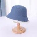 Close-up detail of blue corduroy bucket hat with cozy white faux shearling brim trim. - M (56-58cm) / Blue Double-Sided Corduroy Lamb Wool Bucket Hat