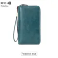 Portefeuille long pour femme anti-RFID avec dragonne fermeture éclair en bleu paon. - Bleu sarcelle
