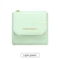 Portefeuille court pour femme vert clair motif crocodile, mini porte-monnaie à trois volets. - Vert clair