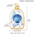 Messing schelp hanger detail, maritiem sieraden component, compact formaat met duidelijke maten. - M433687K2