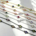 Close-up detail of DIY bezel-set cubic zirconia station chains in multi-color metal finishes. - Gold Multicolor Zirconia
