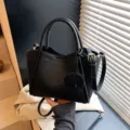 Women stylish soft leather bucket bag casual crossbody handbag with top handle and cute charm - Black
