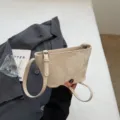 Schicke minimalistische einfarbige Eimertasche für Damen, stylische geprägte Umhängetasche. - Gebrochenes Weiß