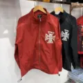 Detail shot of the rhinestone zip-up jacket featuring striking cross graphic and collar. - S / Tops / Red