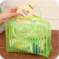 Large transparent PVC waterproof toiletry bag, portable striped cosmetic organizer for travel. - Green
