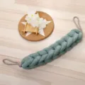 Detailed view of the braided mesh bath back scrubber in grey-green, designed for easy self-bathing. - Mint Green
