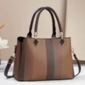 Elegante borsa a mano da donna con design a blocchi di colore e doppi manici pratici. - Giallo ocra