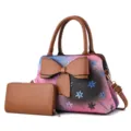 Set borsa e portafoglio floreale sfumato con grande fiocco, elegante dettaglio da vicino. - Giallo ocra