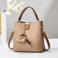 Stylish brown bucket bag with top handle and shoulder strap for women, trendy chic handbag. - Milk Tea