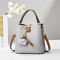 Chic borsa a secchiello a quadri grigi con manico marrone, versatile borsa a tracolla trendy. - Grigio