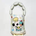Detailed view of the cute cartoon printed bucket bag with padded handle for baby daily outing. - Puppy Padded Bag