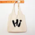 Minimalist beige canvas tote bag for women, large capacity casual shoulder shopping bag. - HI Letter Print Vest Bag