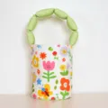 Cute floral canvas bucket bag with padded green handle, colorful cartoon flower print handbag. - Floral Green Handle