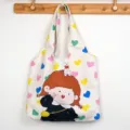 Canvas tote bag with cute cartoon girl and colorful hearts print, casual shoulder bag for students. - Colorful Heart Girl - Vest Bag