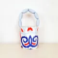 Stylish women canvas bucket bag featuring unique padded handle and trendy ikat print design. - S / Red and Blue Pattern