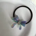 Exquisito coletero de acetata con lazo pequeño, soporte colorido para coleta, accesorio elegante. - Azul Pastel