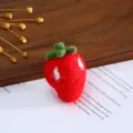 Close-up detail of handmade wool felt strawberry, cute DIY craft accessory for hair clip. - Red Strawberry