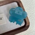 Detailed view of blue translucent flower hair claw clip, showcasing resin texture and design. - Transparent Blue 4.5cm