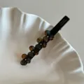 Close-up view of elegant acetate flower duckbill hair clip with sparkling rhinestones. - 8.5cm / Wild Green