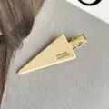 Close-up detail of the beige triangle hair clip featuring elegant handmade style and gold. - Beige-6CM
