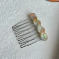 Close-up detail of the French style gradient resin hair comb with metallic teeth for chic styling. - 5.50cm / Multicolor