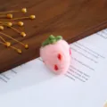 Close-up detail of cute pink wool felt strawberry accessory, perfect for handmade DIY crafts. - Pink Strawberry