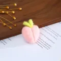 Close-up of handmade pink wool felt peach accessory for cute hat craft and DIY decor details. - Pink Peach