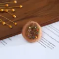 Handmade wool felt round craft accessory with colorful beads detail for DIY hat decor. - Donut Brown