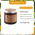 Scented soy candle in a brown glass jar with rich floral and fruity fragrance notes for home. - Freesia