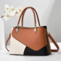 Vue détaillée du sac à main élégant color-block avec empiècements marron, blanc et noir. - 28x12x29cm / Jaune Terre