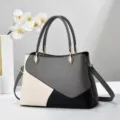 Vista dettagliata di una borsa da donna elegante con design grigio bianco e nero pelle PU. - 28x12x29cm / Grigio
