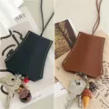 PU Leder Ausziehbare Schlüsseltasche mit Lanyard und süßen Anhängern, modisches Design. - Schwarz