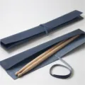 Premium leather drumstick roll bag with wooden drumsticks for drummers detail view. - Blue