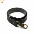 Dark leather curtain tieback with bronze lobster clasp, minimalist home decor accessory. - Black