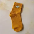 Yellow cotton women mid-calf socks featuring cute embroidered dinosaur design for daily wear. - One Size / Yellow
