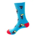 Trendy blue crew socks featuring cute toucan patterns with red heel and toe details. - One Size / Toucan Style